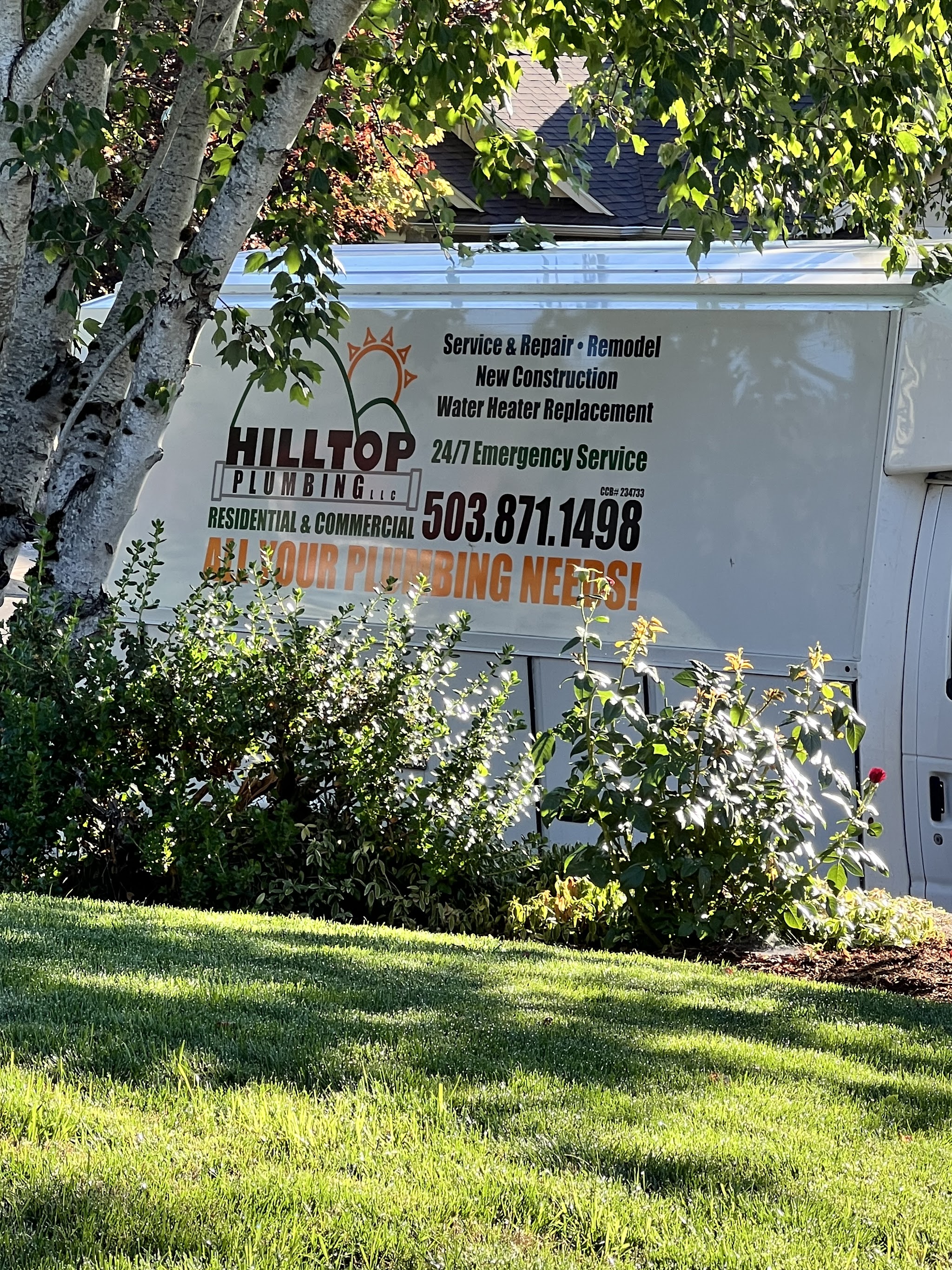 The Hilltop Plumbing truck with full company signage, parked on a residential job in Polk County